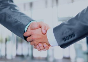 Handshake - two men in suits shaking hands
